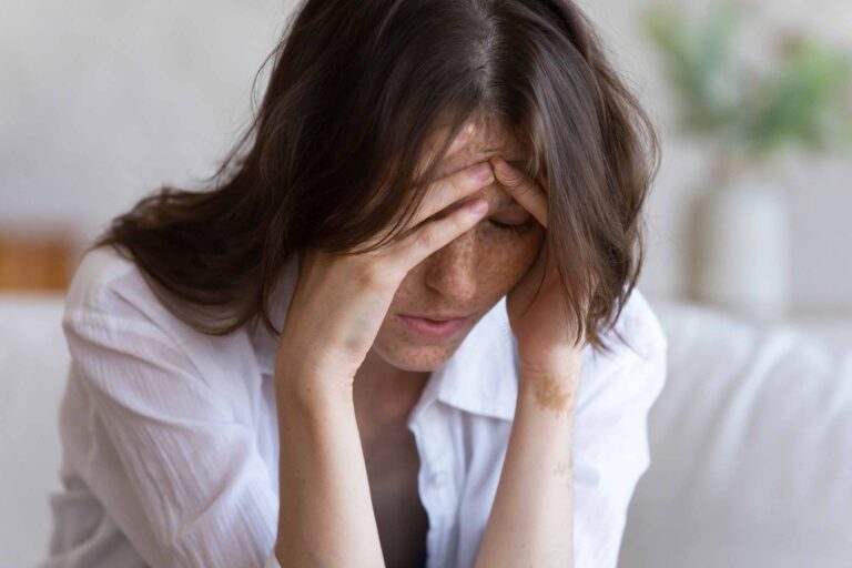 Woman experiencing stress and fatigue at home